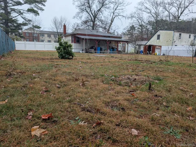 a view of a backyard of the house