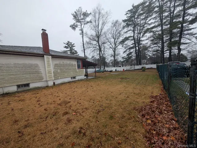 a view of a backyard with tree