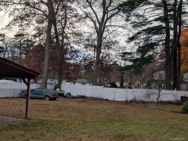 a view of a yard covered in snow