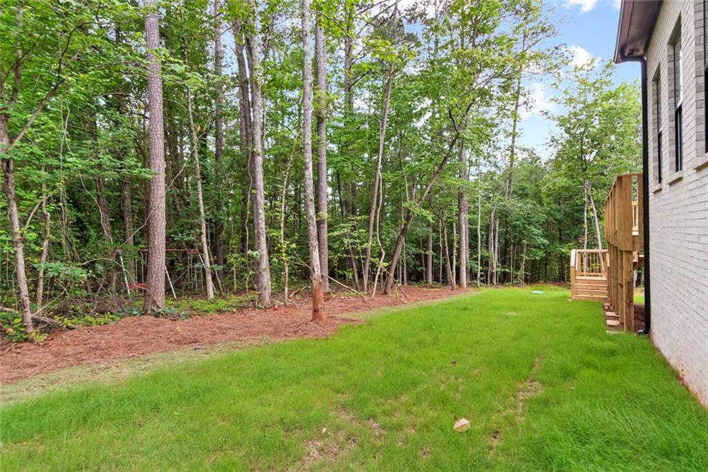 7066 Bells Way Fairburn, GA 30213 - Photo 64 of 64 a view of a park that has large trees with a yard