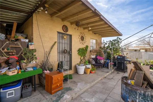 a view of a swimming pool with an ocean and trees in the background