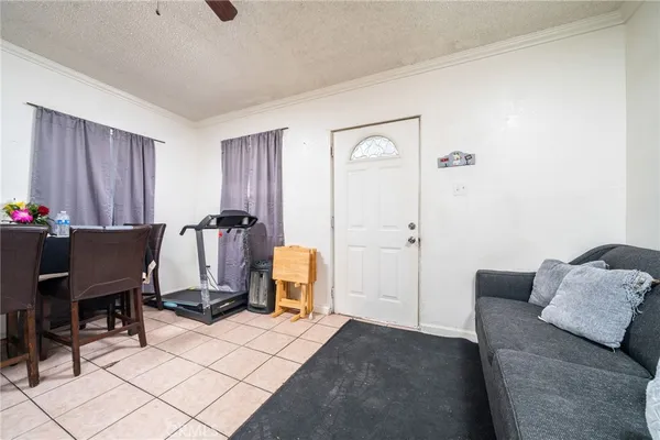 a living room with a couch and a stove top oven