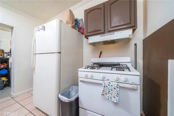 a utility room with dryer washer and other items