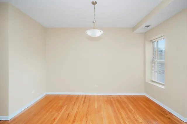 a bathroom with a sink a toilet and shower curtain