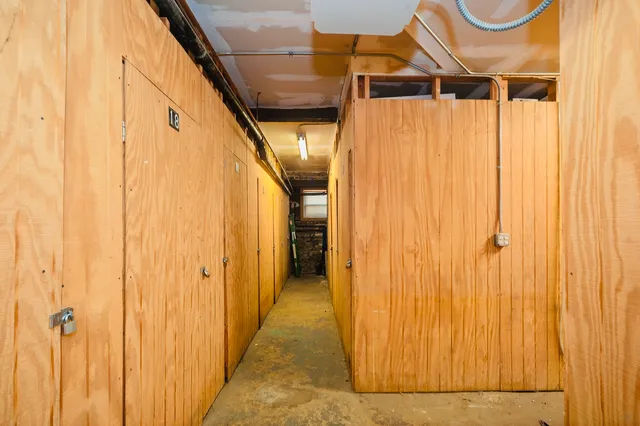a view of a balcony with wooden floor and fence