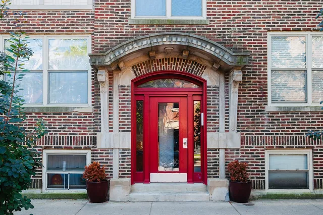 a front view of a building with glass windows