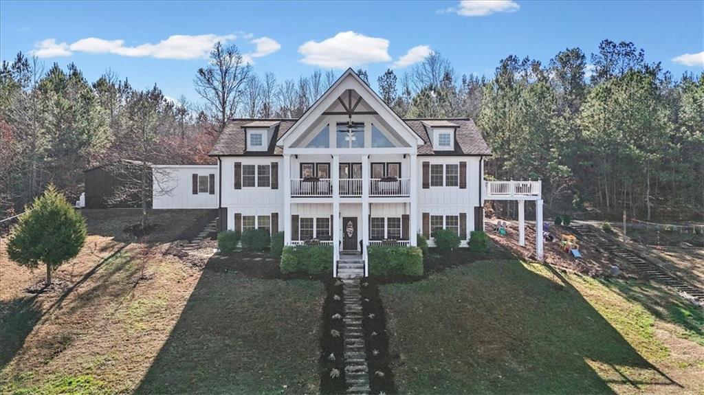 250 Crowe Springs Road Northwest Cartersville, GA 30121 - Photo 1 of 81 a front view of a house with a yard and trees