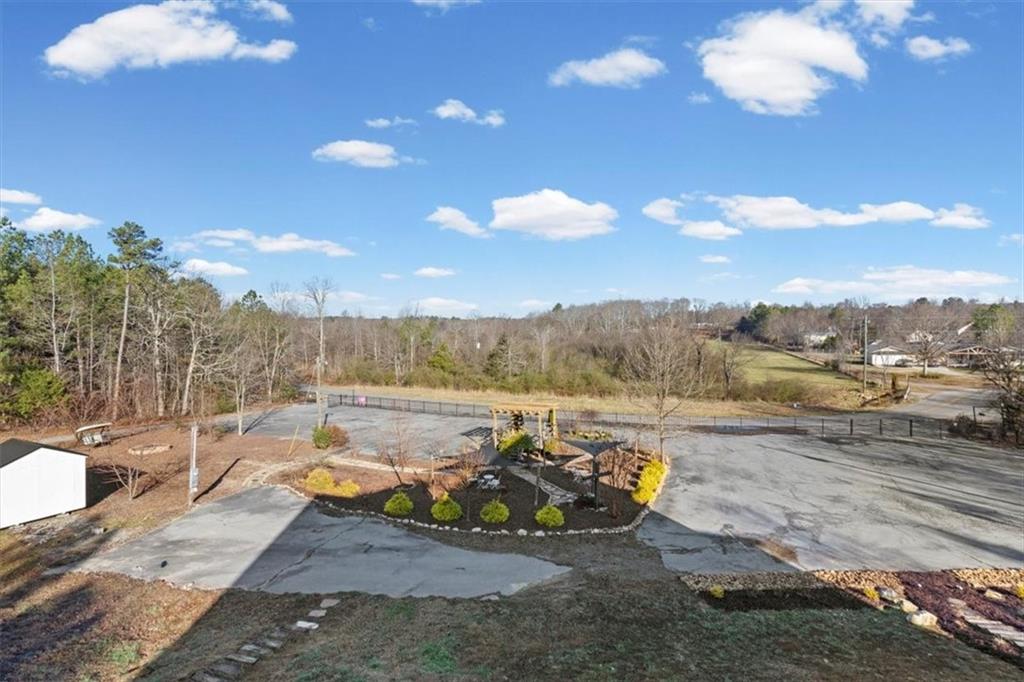 250 Crowe Springs Road Northwest Cartersville, GA 30121 - Photo 64 of 81 a view of a lake with couches and city view