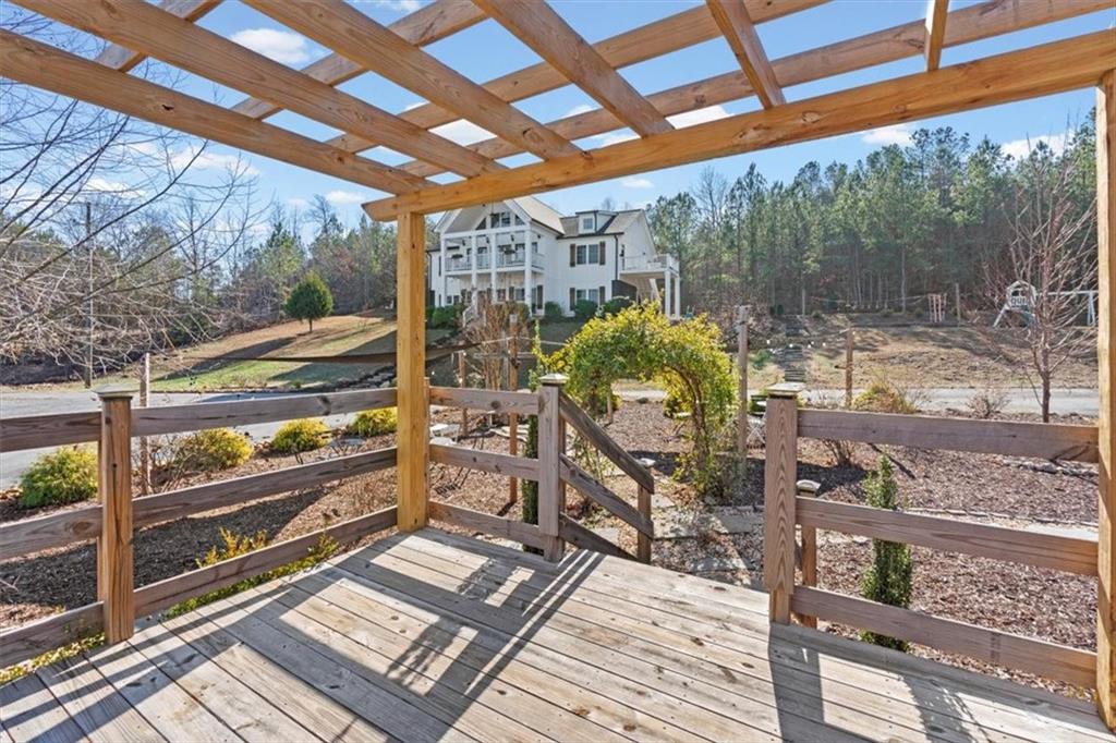 250 Crowe Springs Road Northwest Cartersville, GA 30121 - Photo 70 of 81 a view of a porch with wooden floor