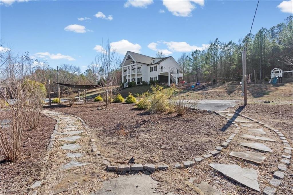 250 Crowe Springs Road Northwest Cartersville, GA 30121 - Photo 71 of 81 a view of a house with a yard and sitting area