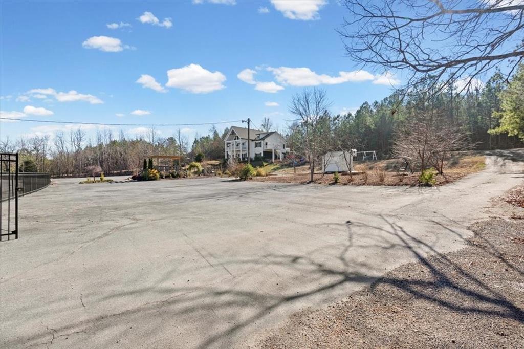 250 Crowe Springs Road Northwest Cartersville, GA 30121 - Photo 73 of 81 a view of a dry yard with wooden fence