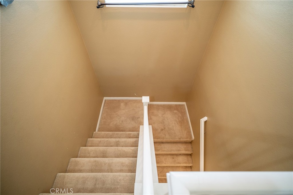 13208 Firestone Drive Rancho Cucamonga, CA 91739 - Photo 11 of 21 a view of staircase with white walls