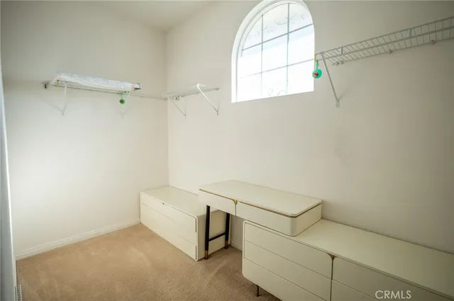 a bathroom with a window and a shower