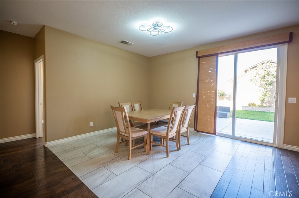 13208 Firestone Drive Rancho Cucamonga, CA 91739 - Photo 5 of 21 a view of a dining room with furniture and wooden floor