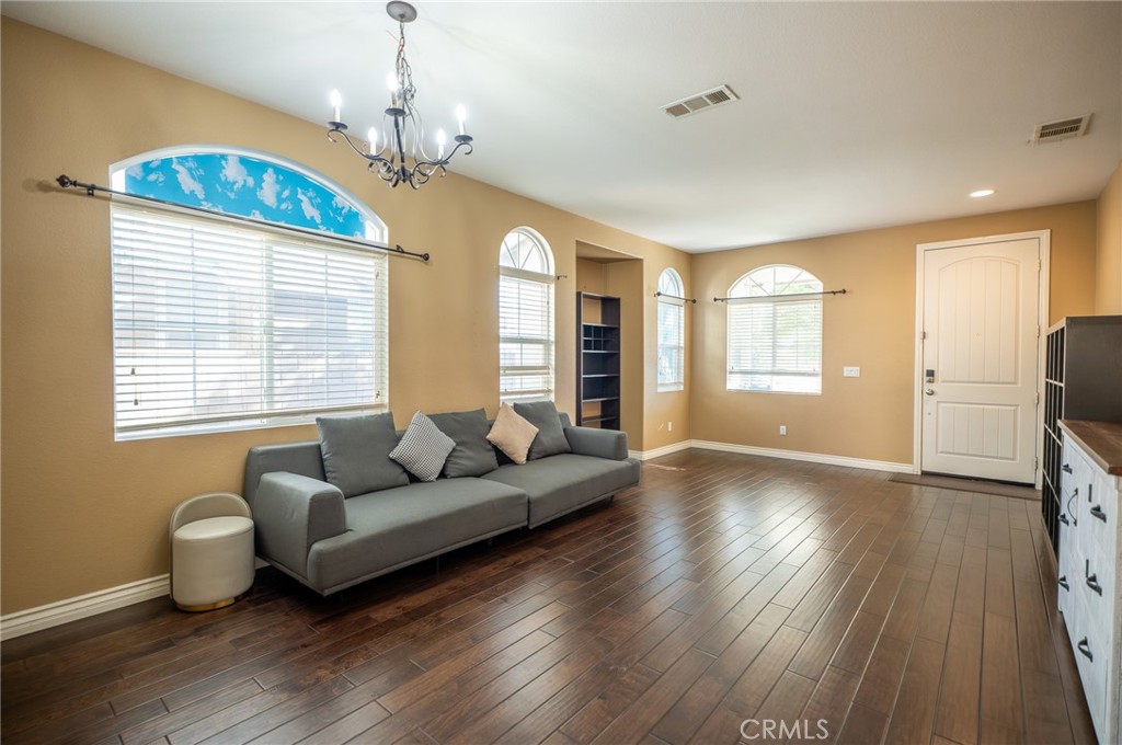 13208 Firestone Drive Rancho Cucamonga, CA 91739 - Photo 6 of 21 a living room with furniture and a chandelier
