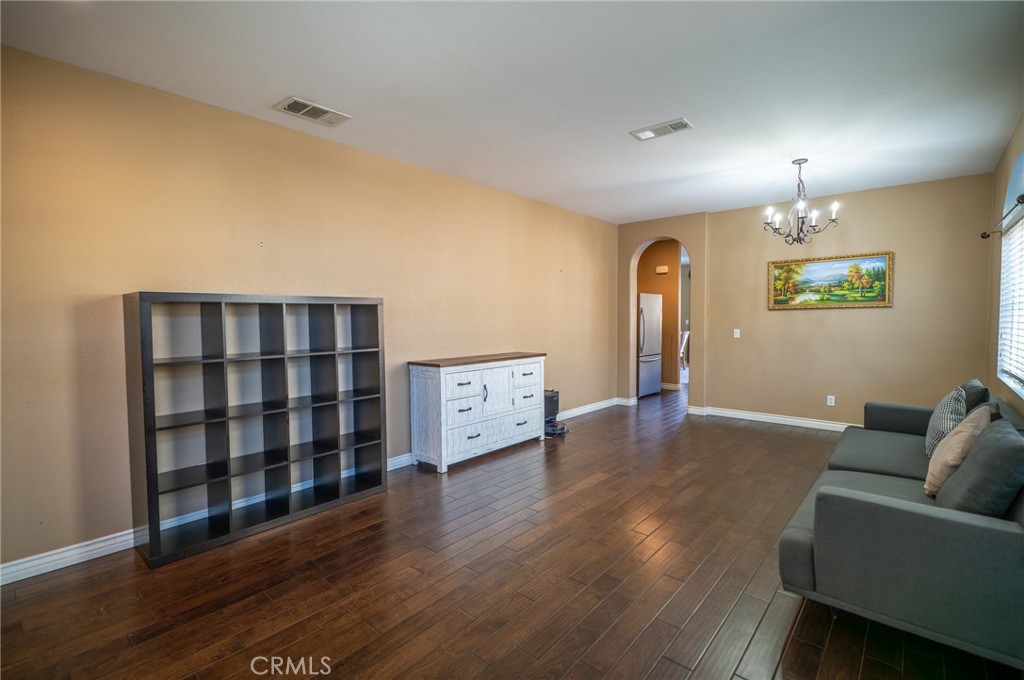 13208 Firestone Drive Rancho Cucamonga, CA 91739 - Photo 7 of 21 a living room with furniture and wooden floor