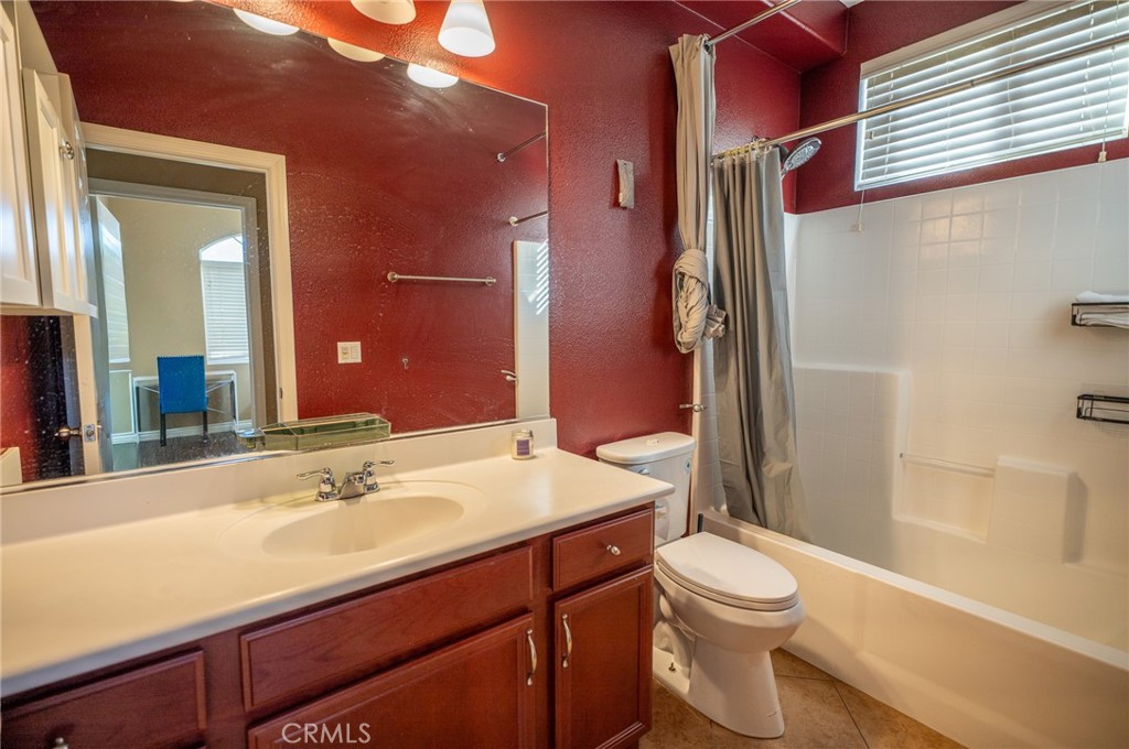 13208 Firestone Drive Rancho Cucamonga, CA 91739 - Photo 10 of 21 a bathroom with a sink a toilet and shower