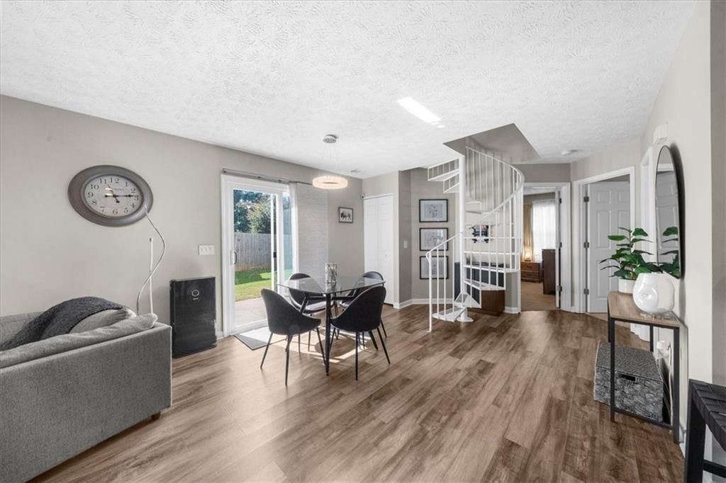 820 Camelon Court Alpharetta, GA 30004 - Photo 14 of 33 a living room with furniture and wooden floor