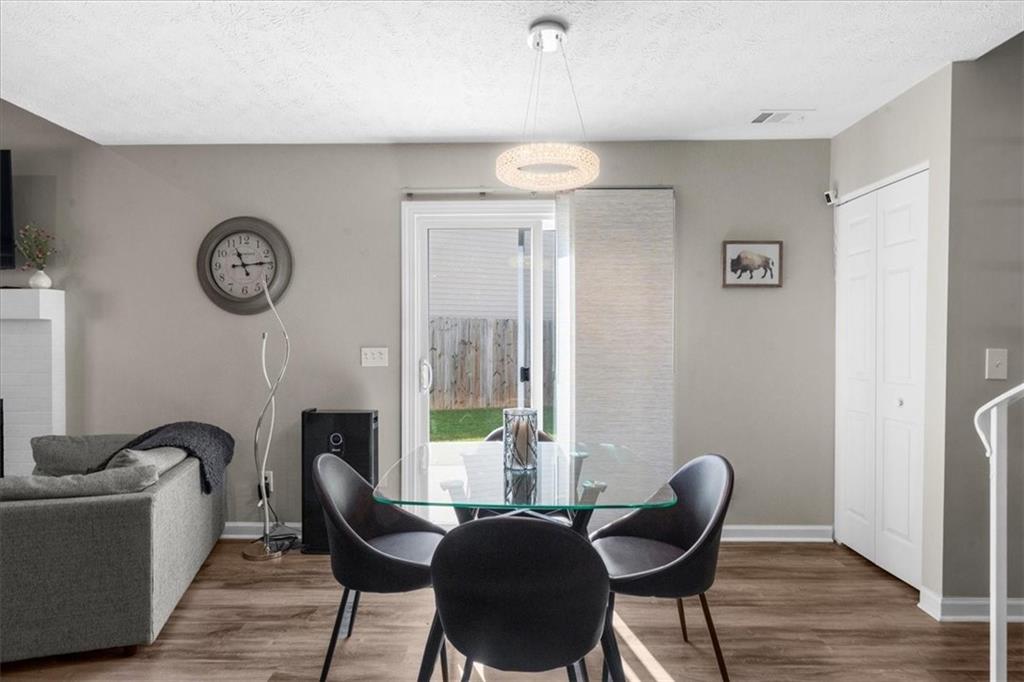 820 Camelon Court Alpharetta, GA 30004 - Photo 15 of 33 a view of a livingroom with furniture and a chair