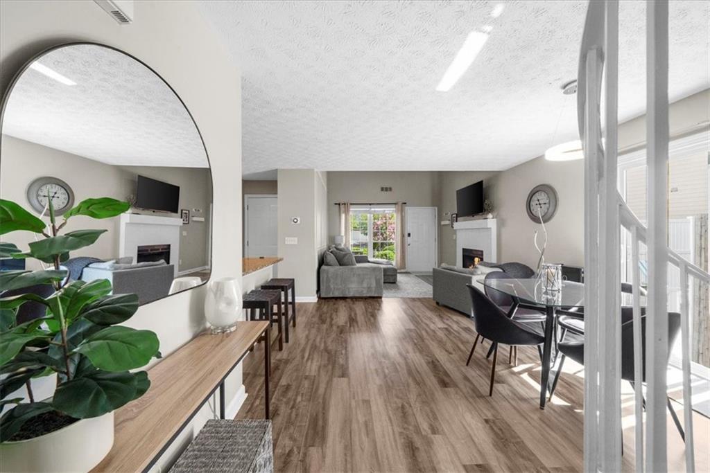 820 Camelon Court Alpharetta, GA 30004 - Photo 18 of 33 a living room with furniture and wooden floor