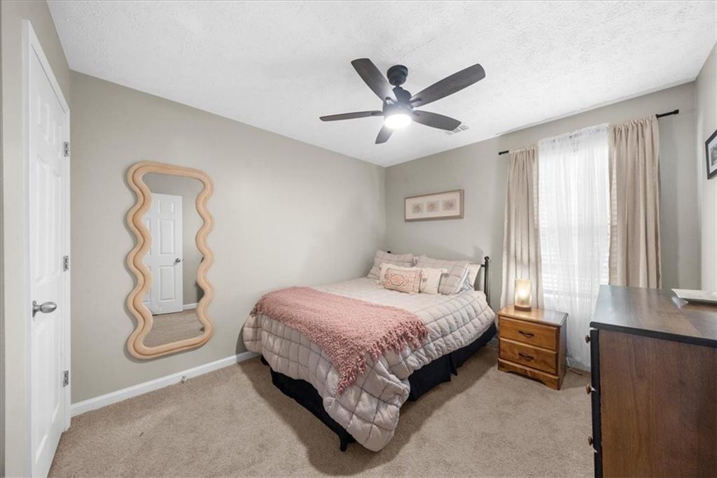 820 Camelon Court Alpharetta, GA 30004 - Photo 20 of 33 a bedroom with a bed and a window