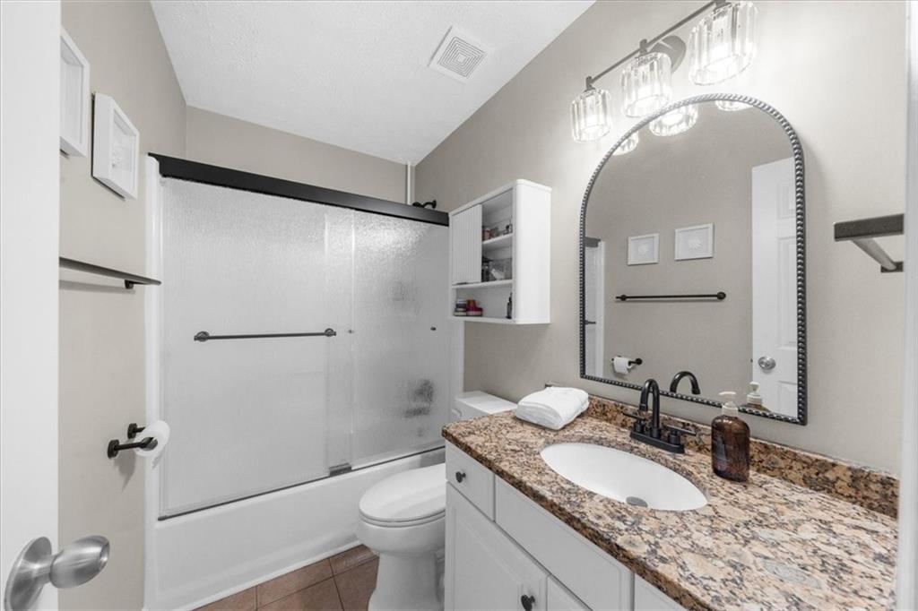820 Camelon Court Alpharetta, GA 30004 - Photo 22 of 33 a bathroom with a granite countertop sink toilet and shower