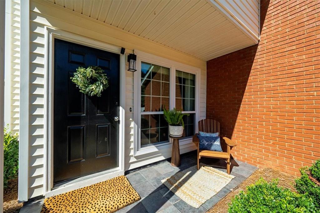 820 Camelon Court Alpharetta, GA 30004 - Photo 3 of 33 a bench in front of door