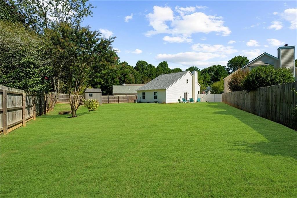 820 Camelon Court Alpharetta, GA 30004 - Photo 32 of 33 a house view with a garden space