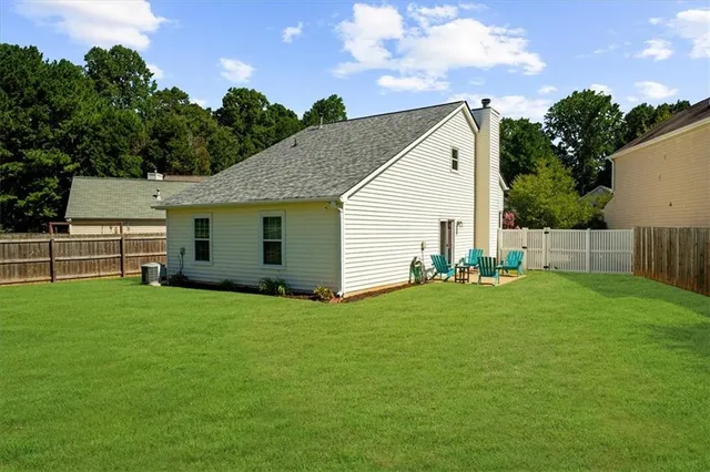 a view of a backyard with plants and a garden