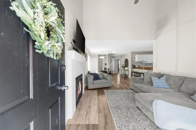 a living room with furniture and a potted plant