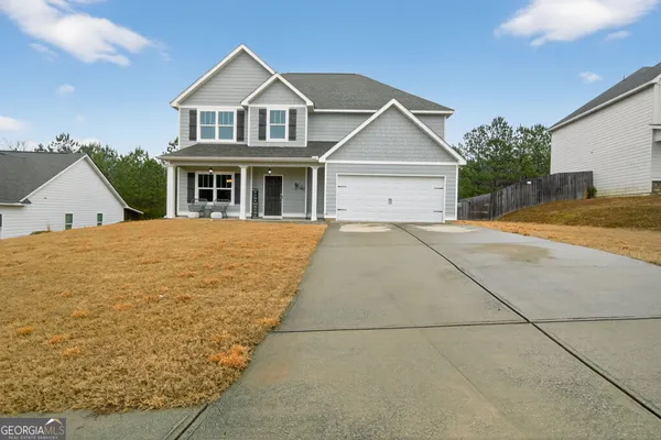 a view of a house with a yard