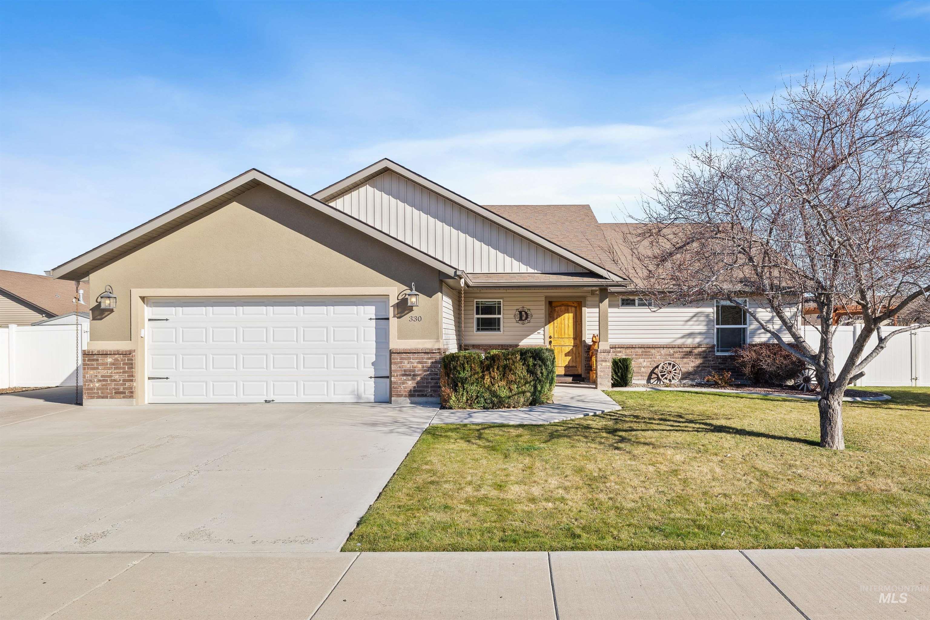 330 Arrowhead Path Twin Falls, ID 83301 - Photo 1 of 37 Ranch-style house with a garage, driveway, board and batten siding, and brick siding
