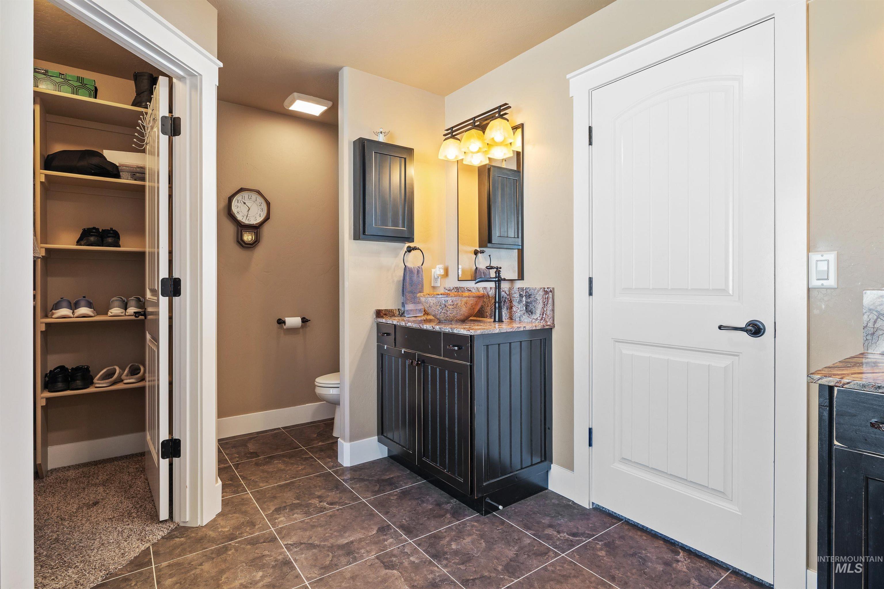 330 Arrowhead Path Twin Falls, ID 83301 - Photo 14 of 37 Bathroom with vanity and dark tile patterned floors