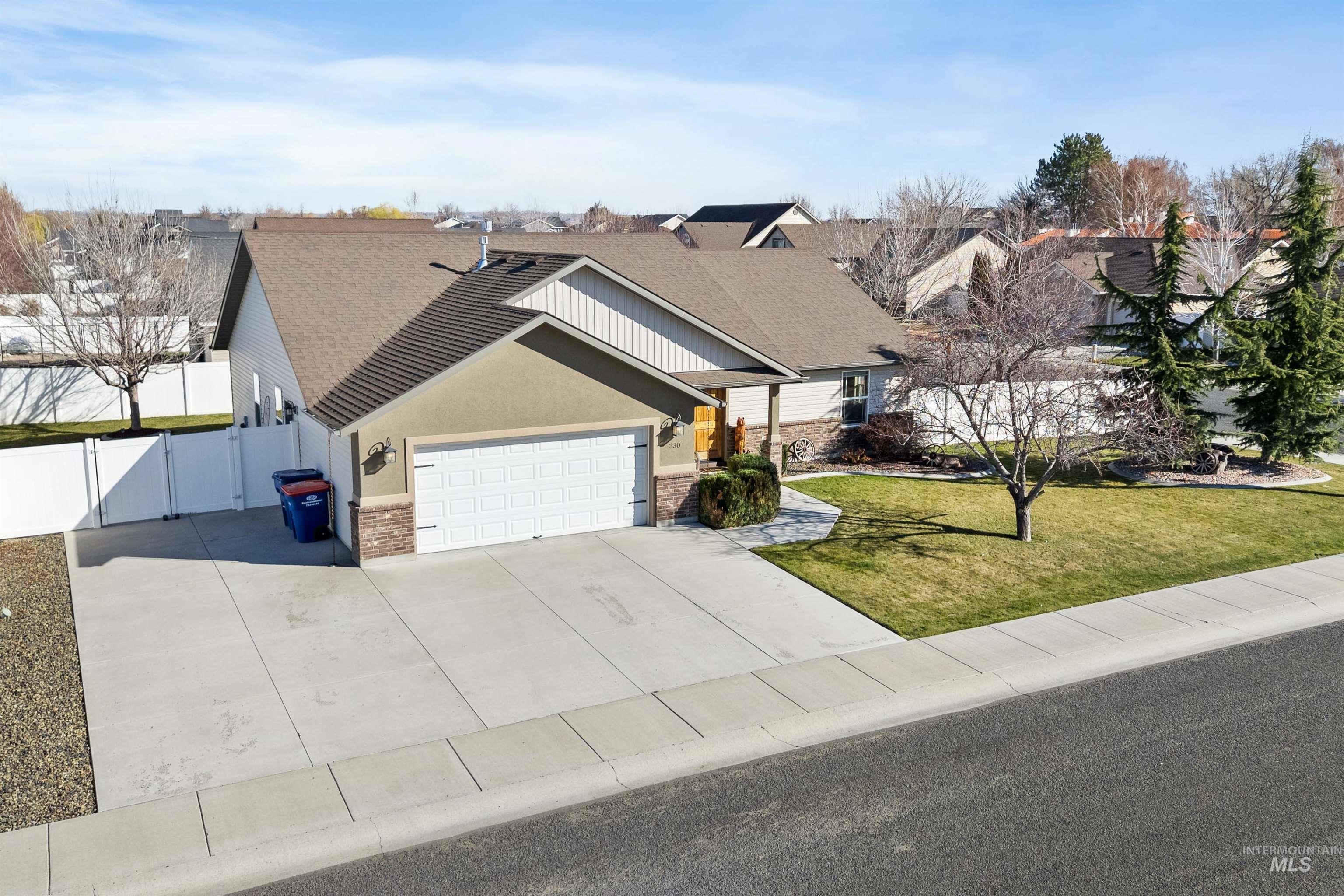 330 Arrowhead Path Twin Falls, ID 83301 - Photo 28 of 37 View of front facade featuring a garage, driveway, a gate, and stucco siding