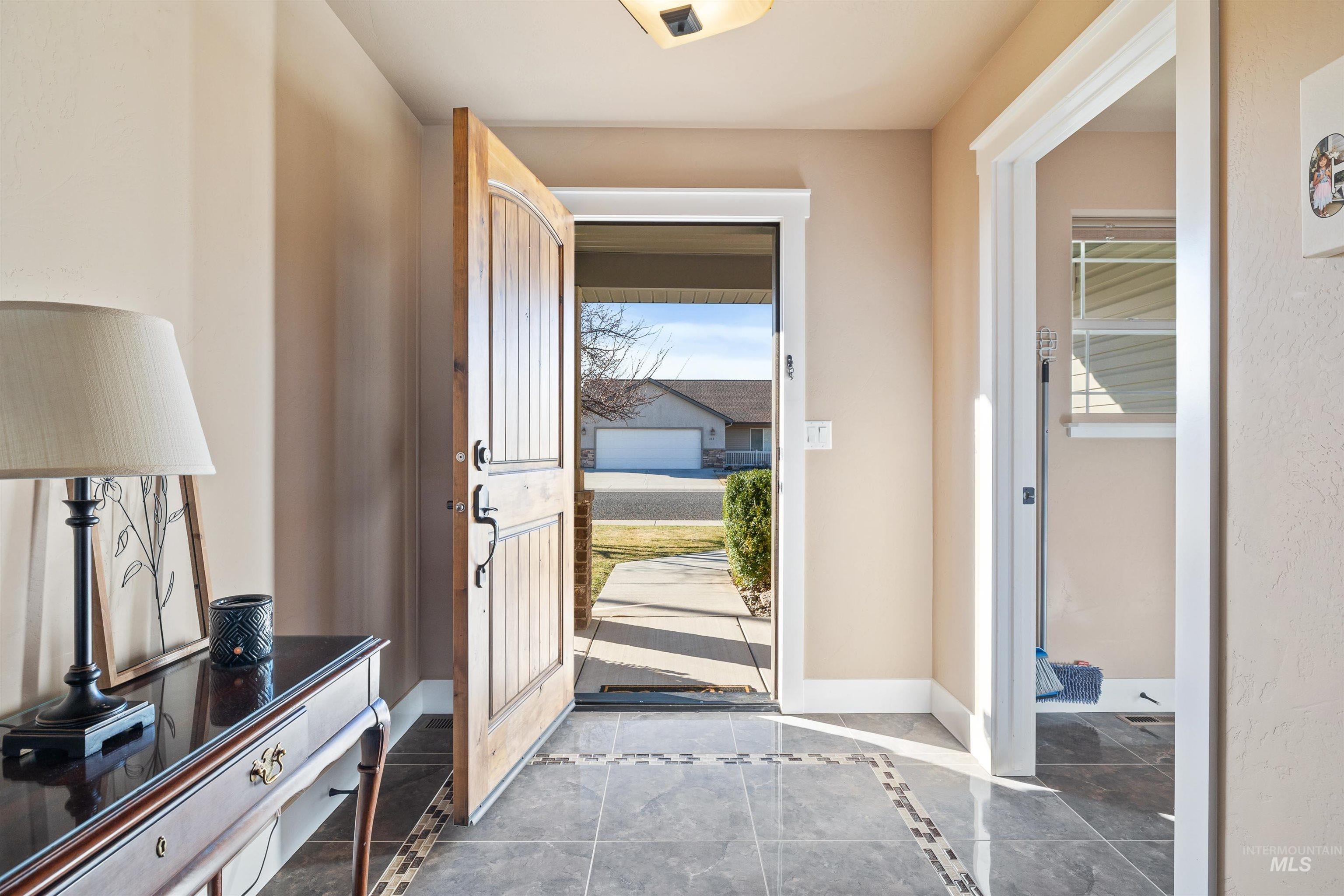 330 Arrowhead Path Twin Falls, ID 83301 - Photo 3 of 37 Foyer with inlaid floor details and baseboards