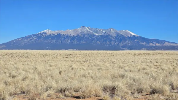a view of ocean with a mountain