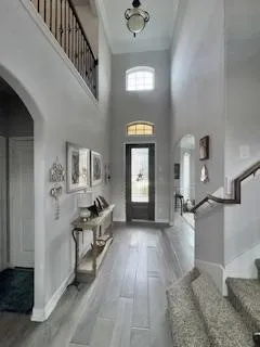 a view of a livingroom with furniture and hardwood floor