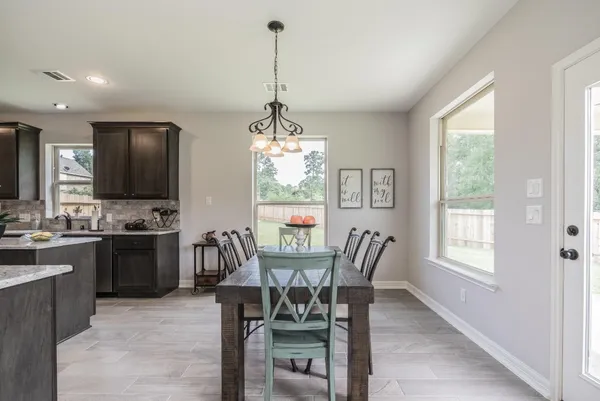 a view of a dining room with furniture window and outside view