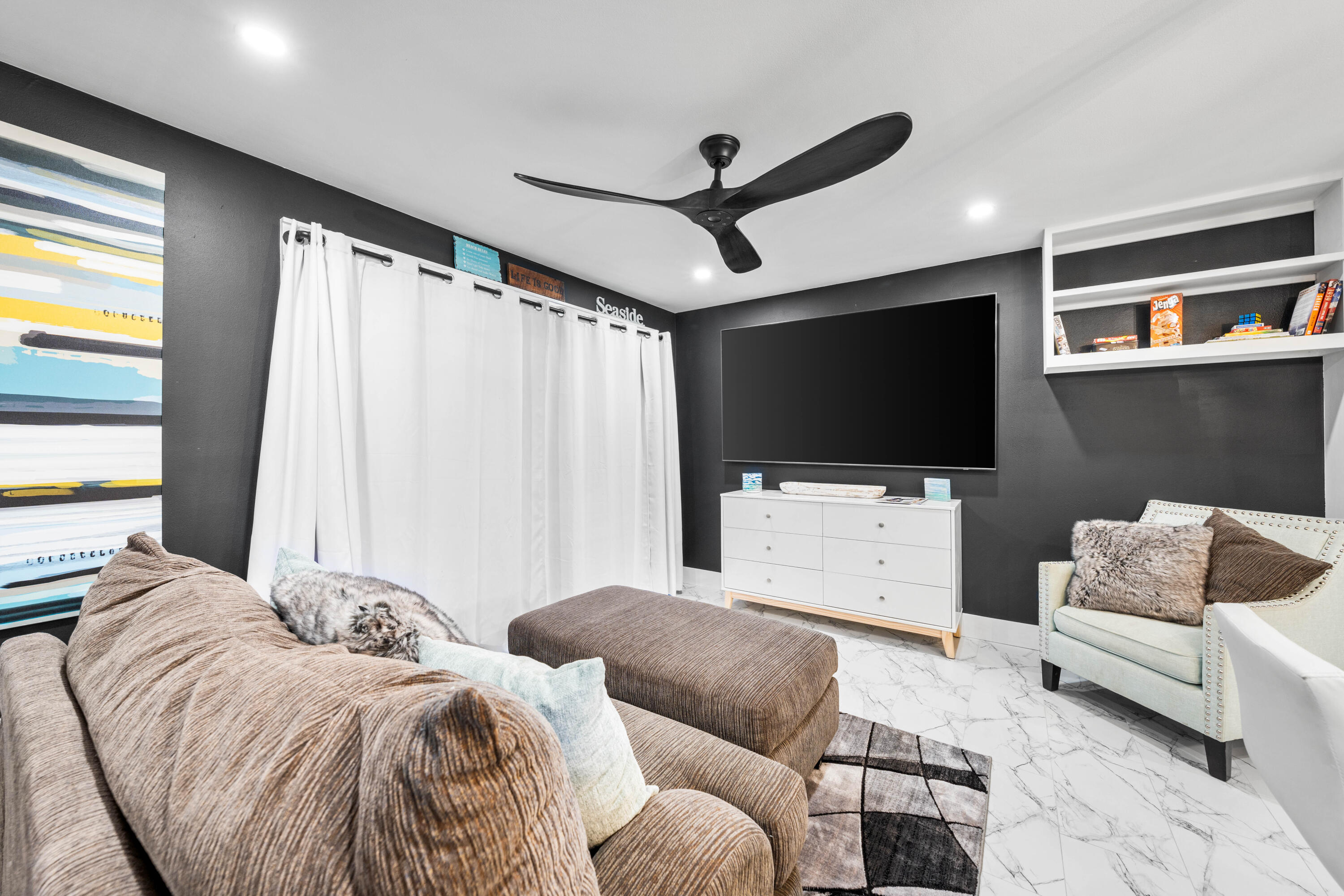 101 Cain Road, Unit O Panama City Beach, FL 32413 - Photo 11 of 29 a living room with furniture and a flat screen tv