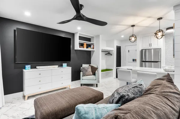 a living room with furniture and a flat screen tv