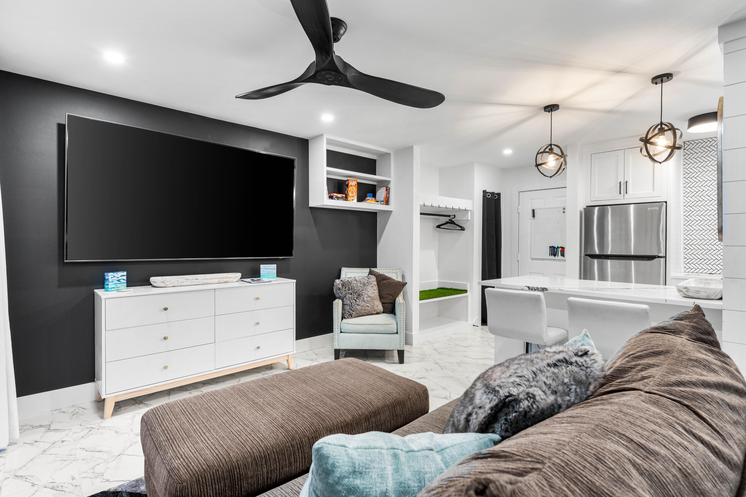 101 Cain Road, Unit O Panama City Beach, FL 32413 - Photo 12 of 29 a living room with furniture and a flat screen tv