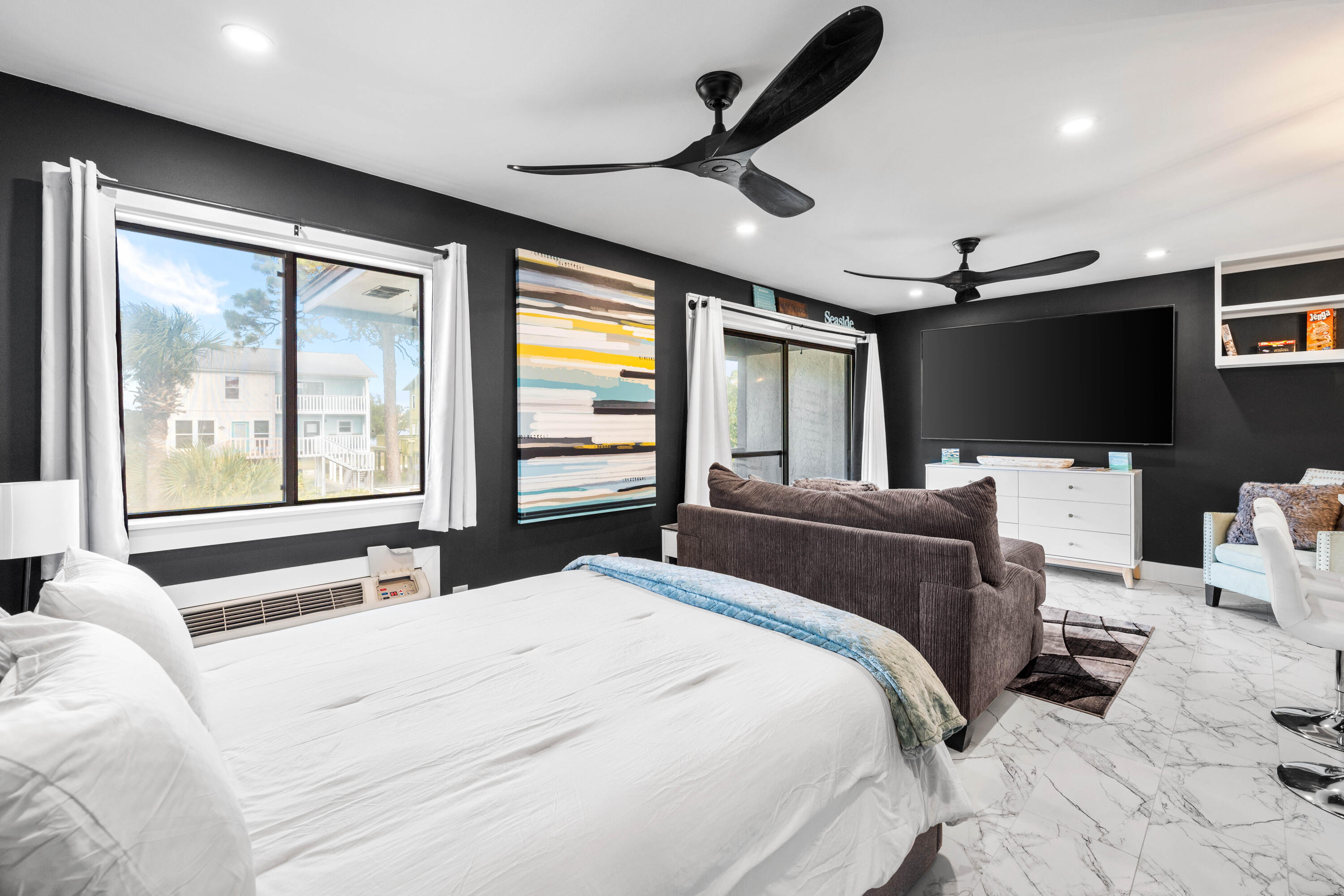 101 Cain Road, Unit O Panama City Beach, FL 32413 - Photo 13 of 29 a bedroom with a bed window and flat screen tv