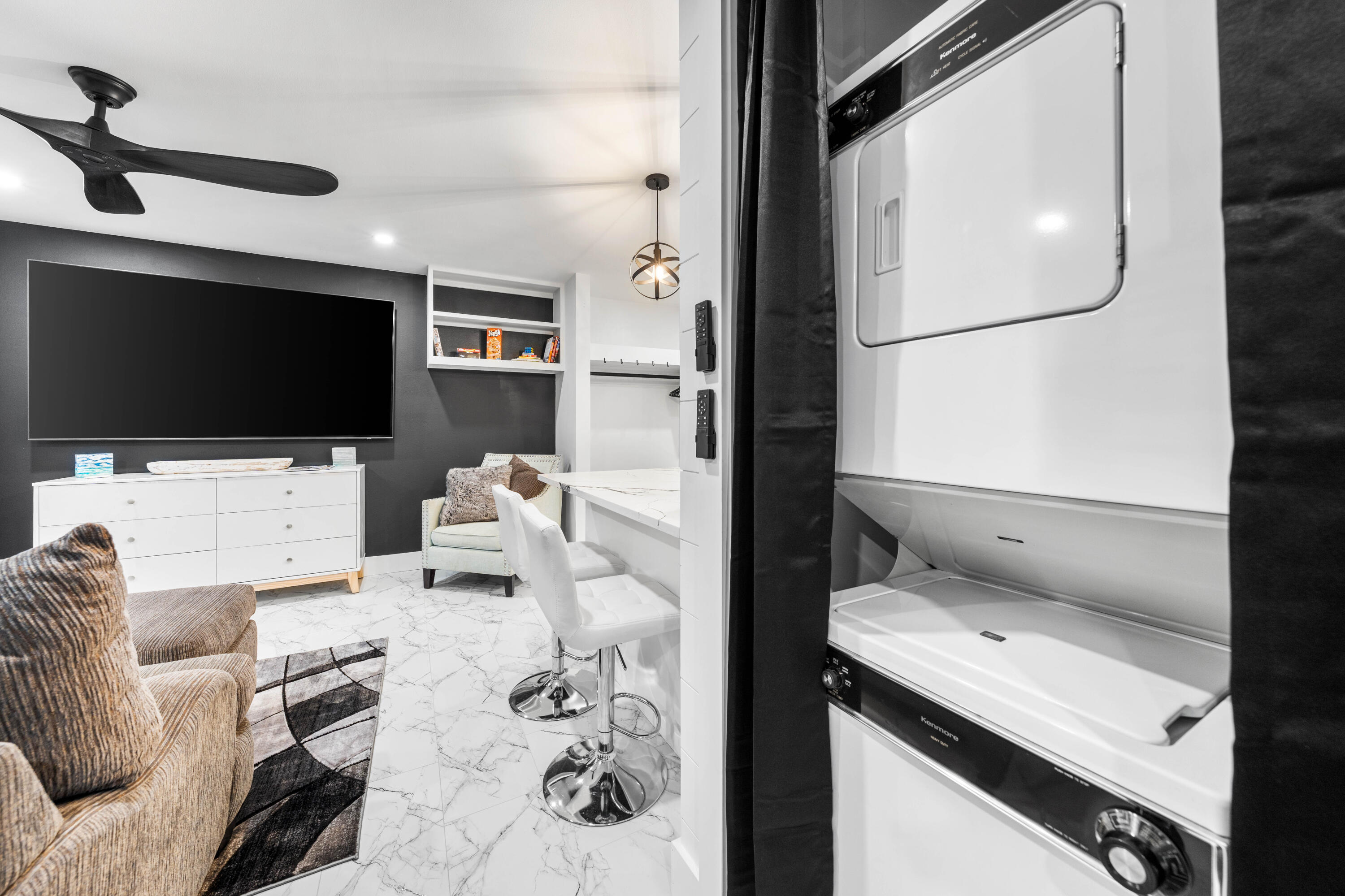 101 Cain Road, Unit O Panama City Beach, FL 32413 - Photo 15 of 29 a living room with furniture and a flat screen tv