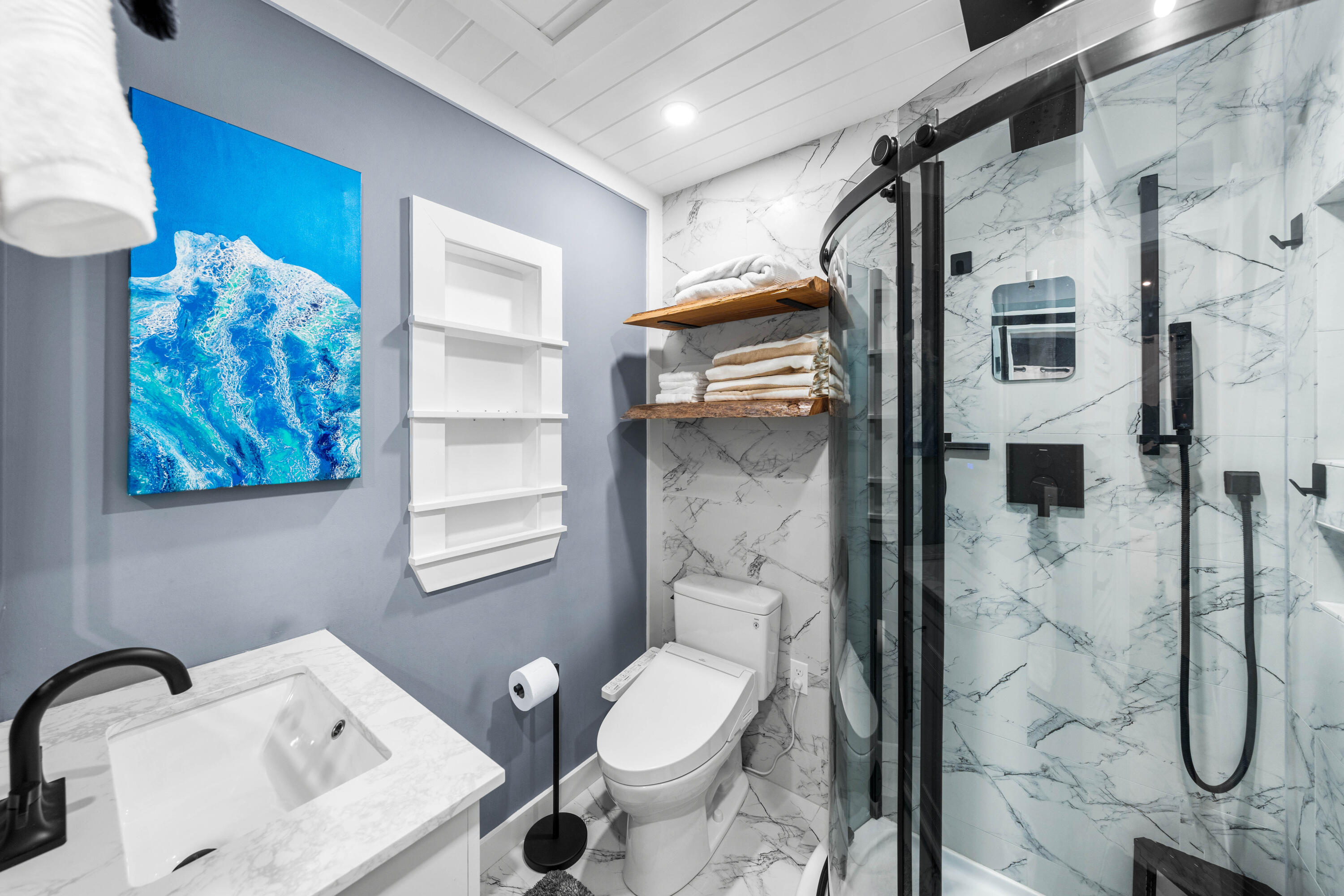 101 Cain Road, Unit O Panama City Beach, FL 32413 - Photo 16 of 29 a bathroom with a toilet sink and shower