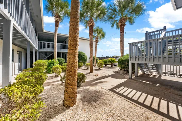 a view of a swimming pool with an outdoor seating