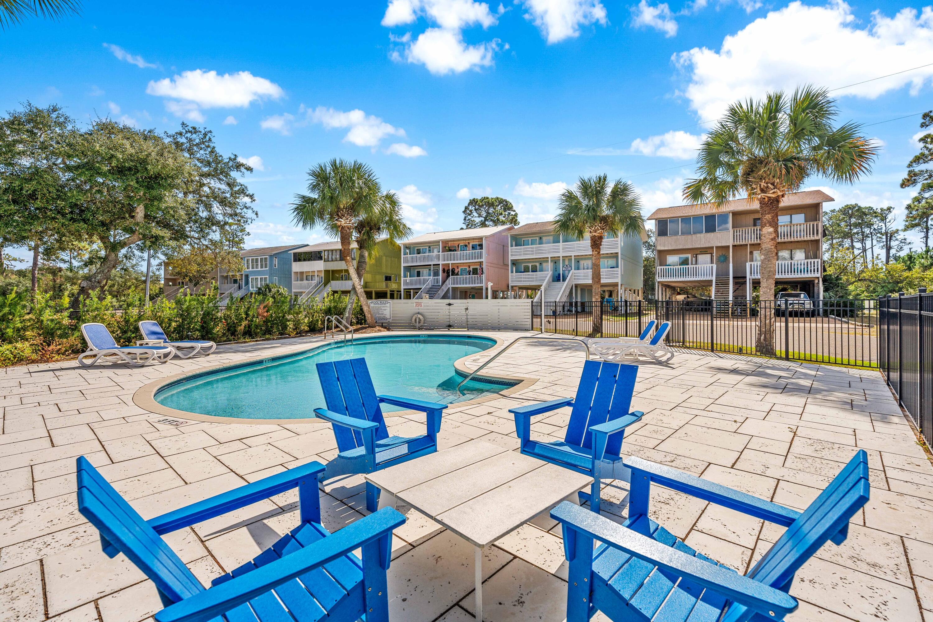 101 Cain Road, Unit O Panama City Beach, FL 32413 - Photo 25 of 29 a view of outdoor space yard swimming pool and patio