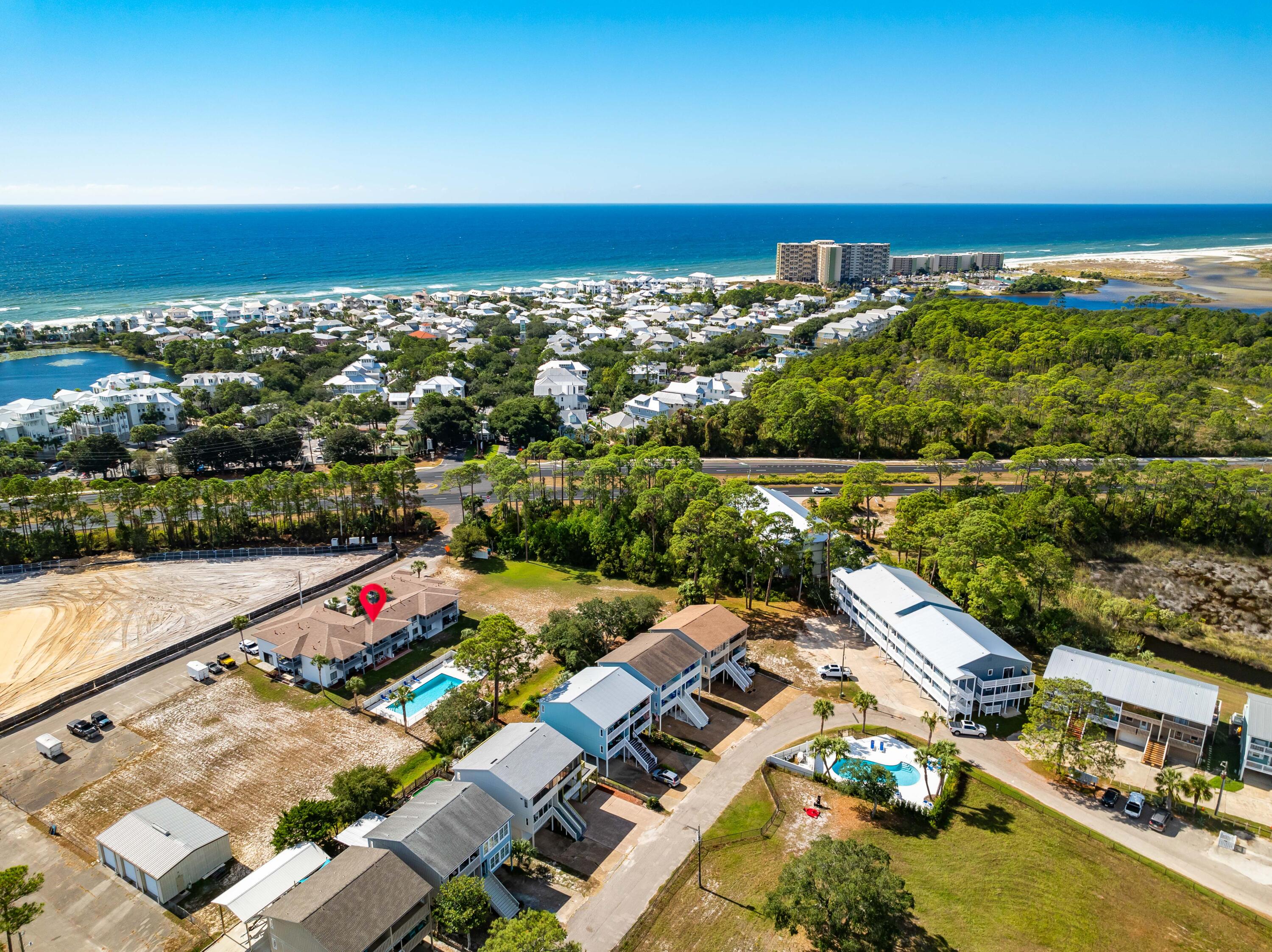 101 Cain Road, Unit O Panama City Beach, FL 32413 - Photo 28 of 29 an aerial view of a city with lots of residential buildings ocean and mountain view in back