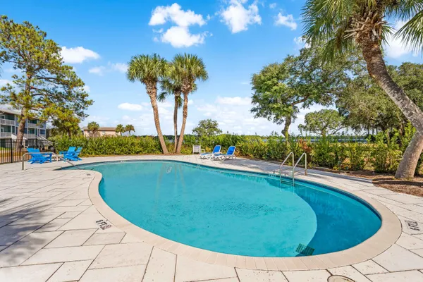 a view of a swimming pool with a yard