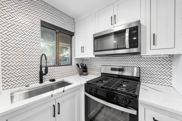 a kitchen with a stove and a microwave