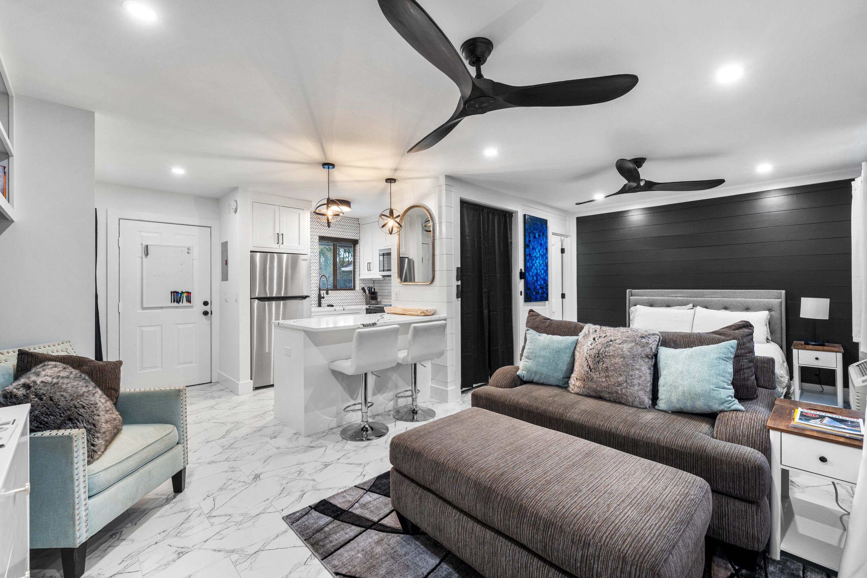 101 Cain Road, Unit O Panama City Beach, FL 32413 - Photo 10 of 29 a living room with furniture and kitchen view